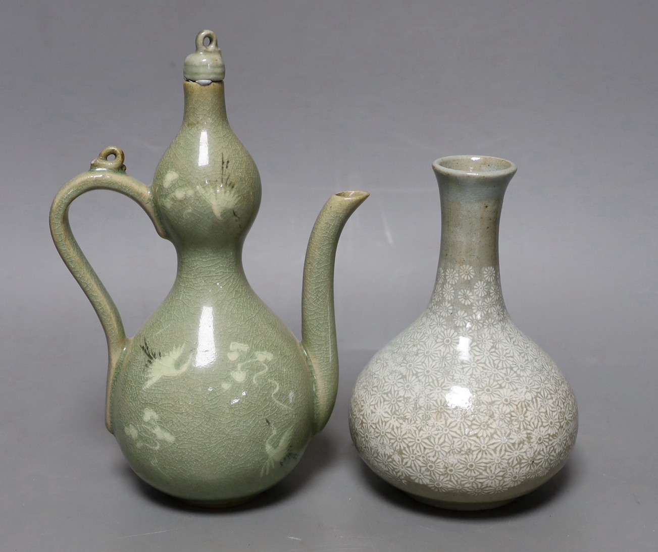 A Korean celadon wine pot and a similar vase, tallest 22cm